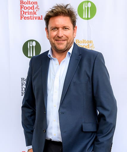 Man stood at an awards ceremony for Bolton Food and Drink Festival