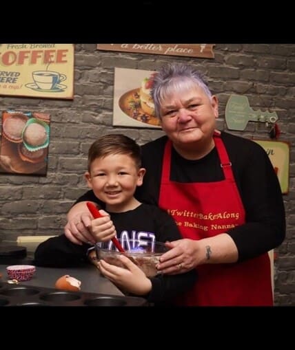 Adult and child baking together
