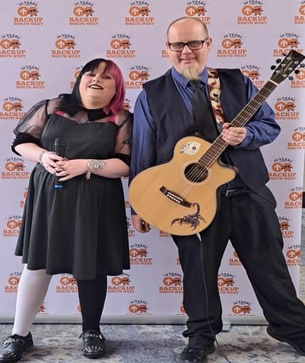 Two people that are part of a duet