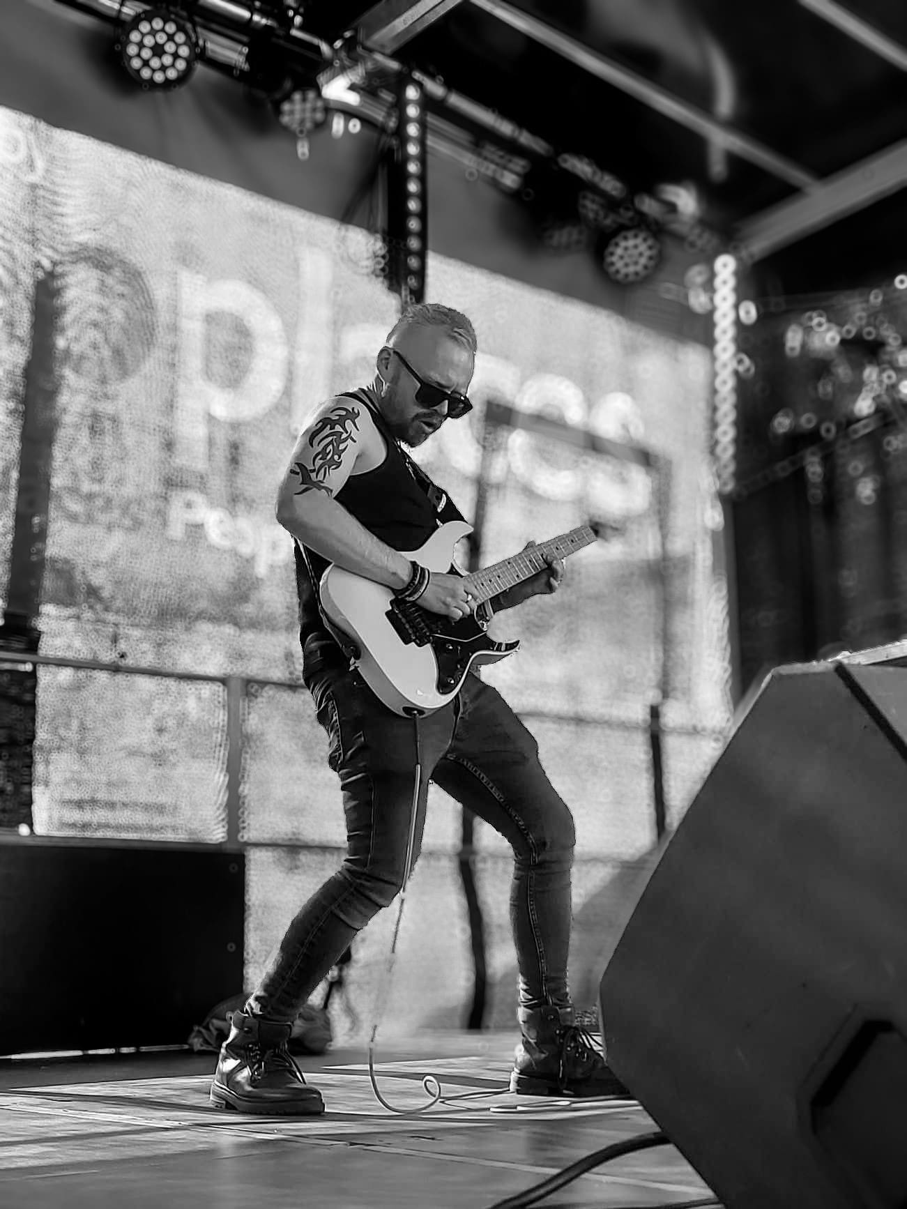 Black and white image someone performing on stage