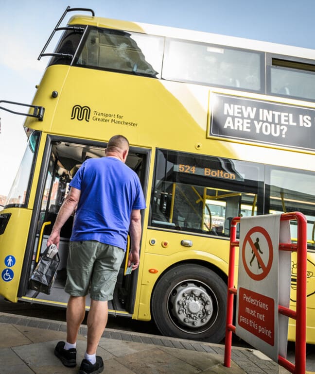 Person getting on bus at Bolton Interchange