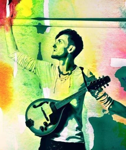 Colourful image of a musician posing with an instrument