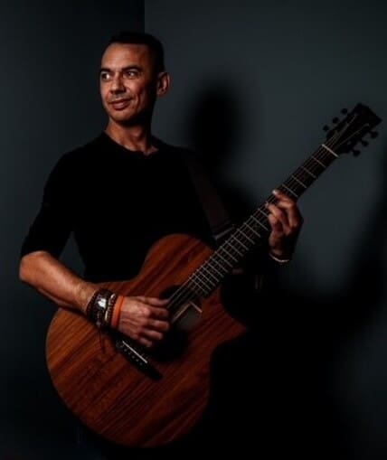 Performer holding a guitar
