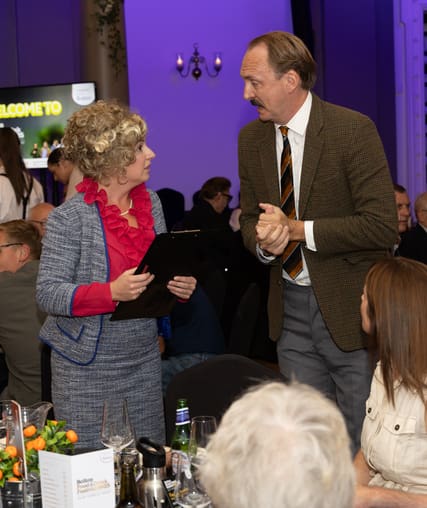 Two entertainers performing a comedy dining experience