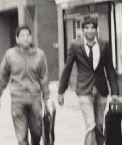 Two musical performers walking