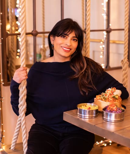 Somebody sat on a swing in a restaurant